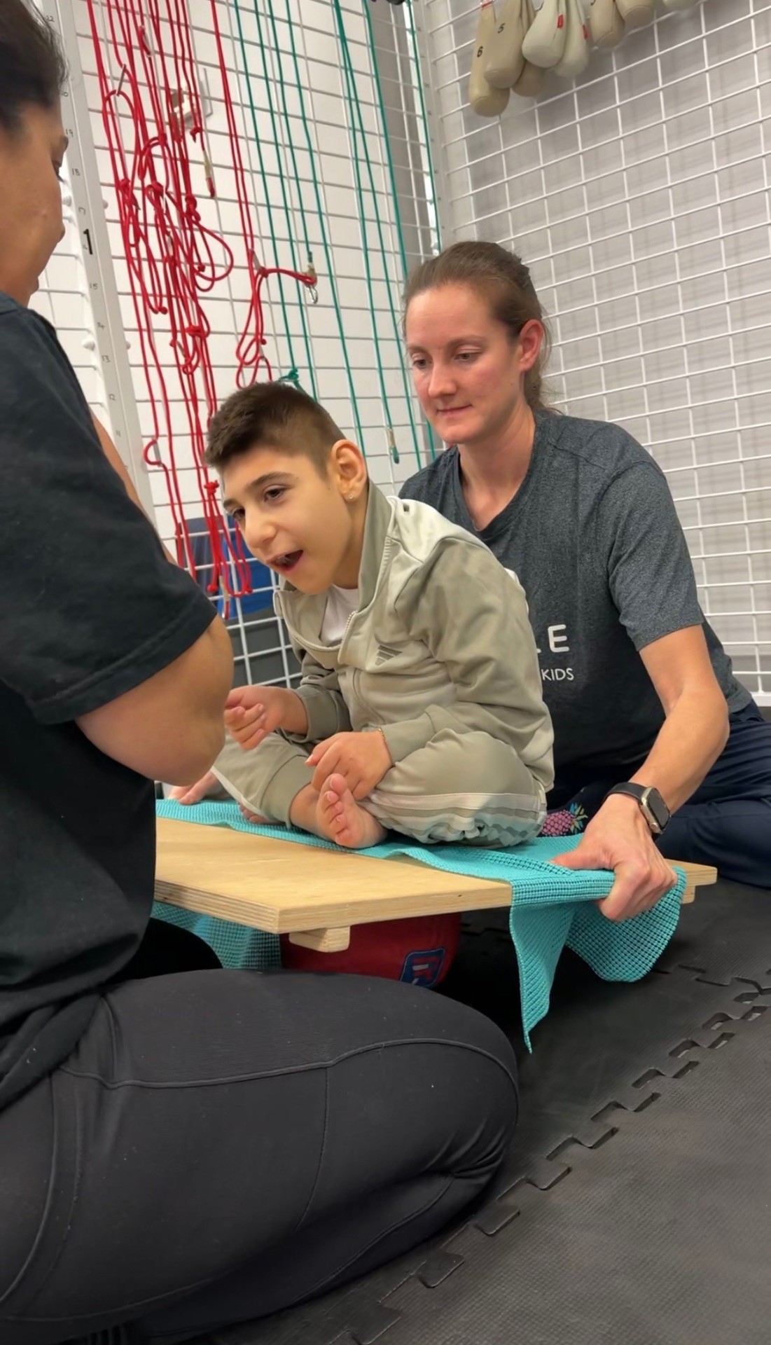 Sal sitting on a bench doing postural work
