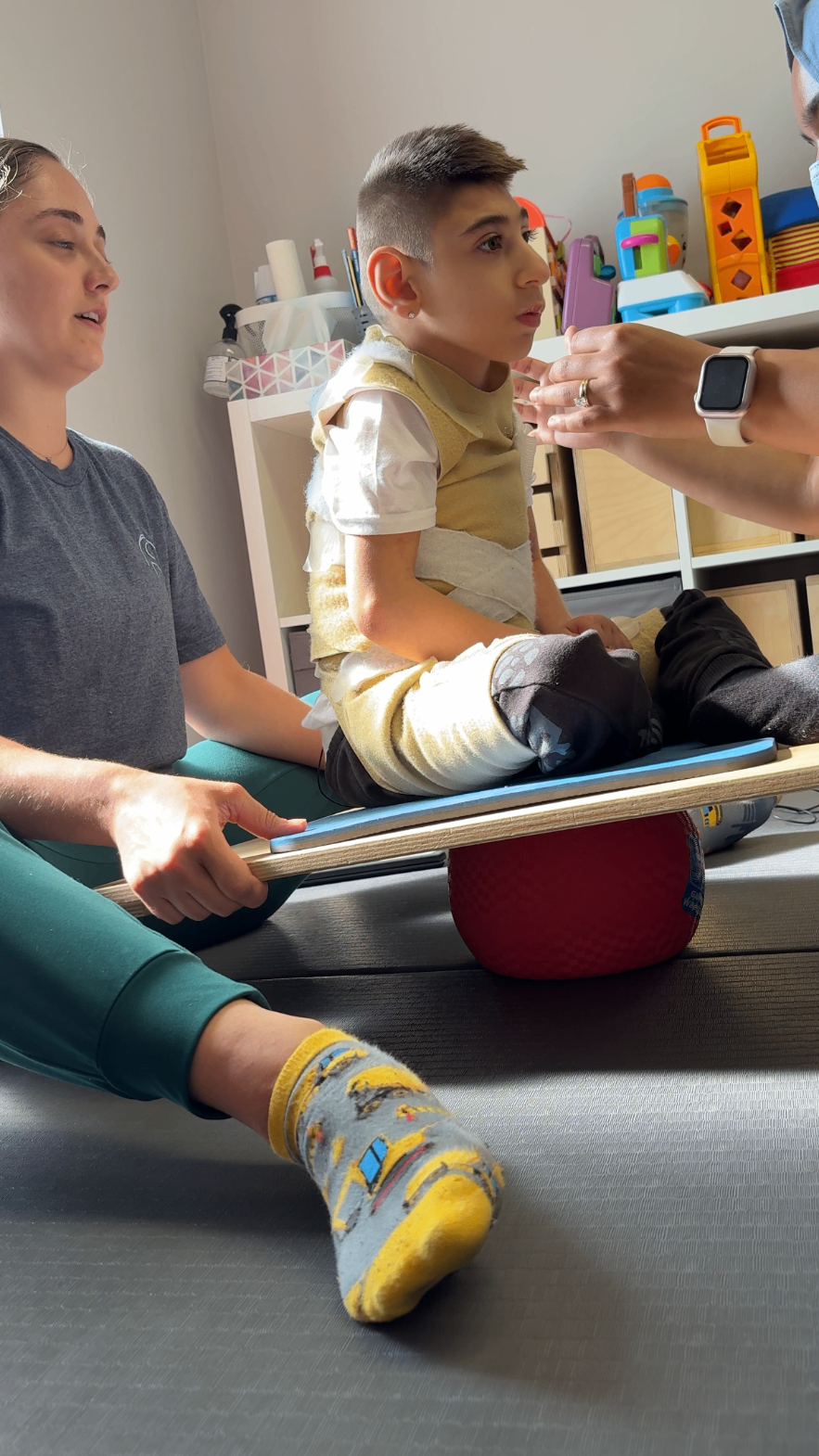Sal balancing seated on a therapy board