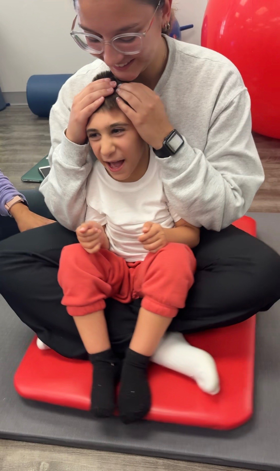 Sal laughing during a therapy session