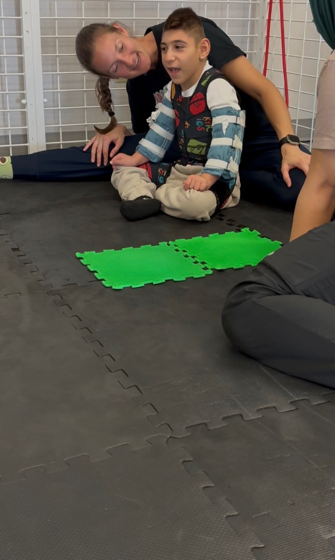 Sal sitting on the floor working on trunk control